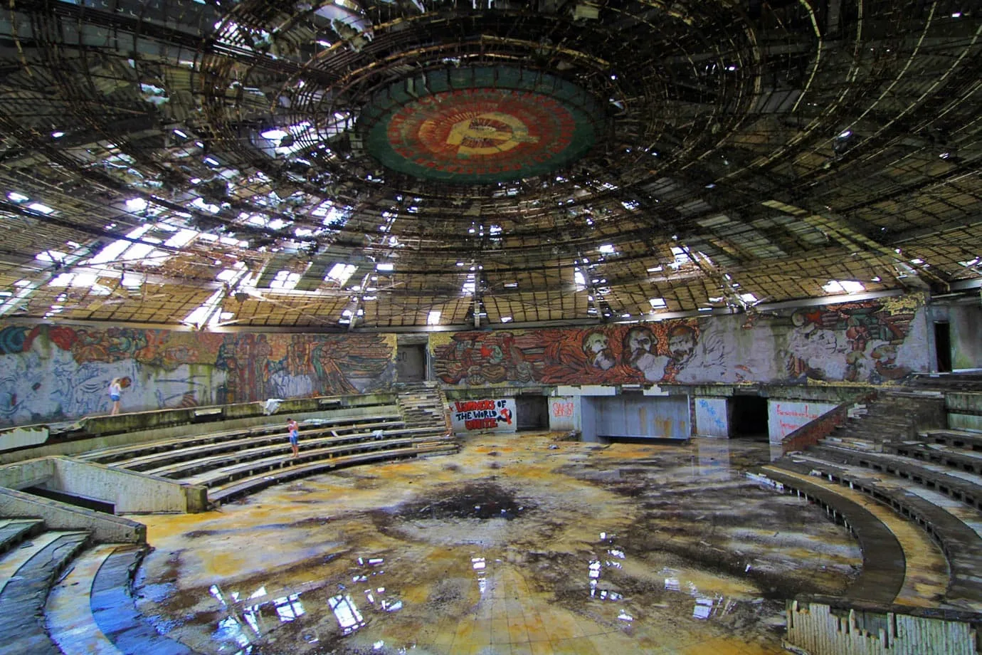 The main auditorium, much like the rest of Buzludzha, is in complete disrepair with rubble and glass on the floor
