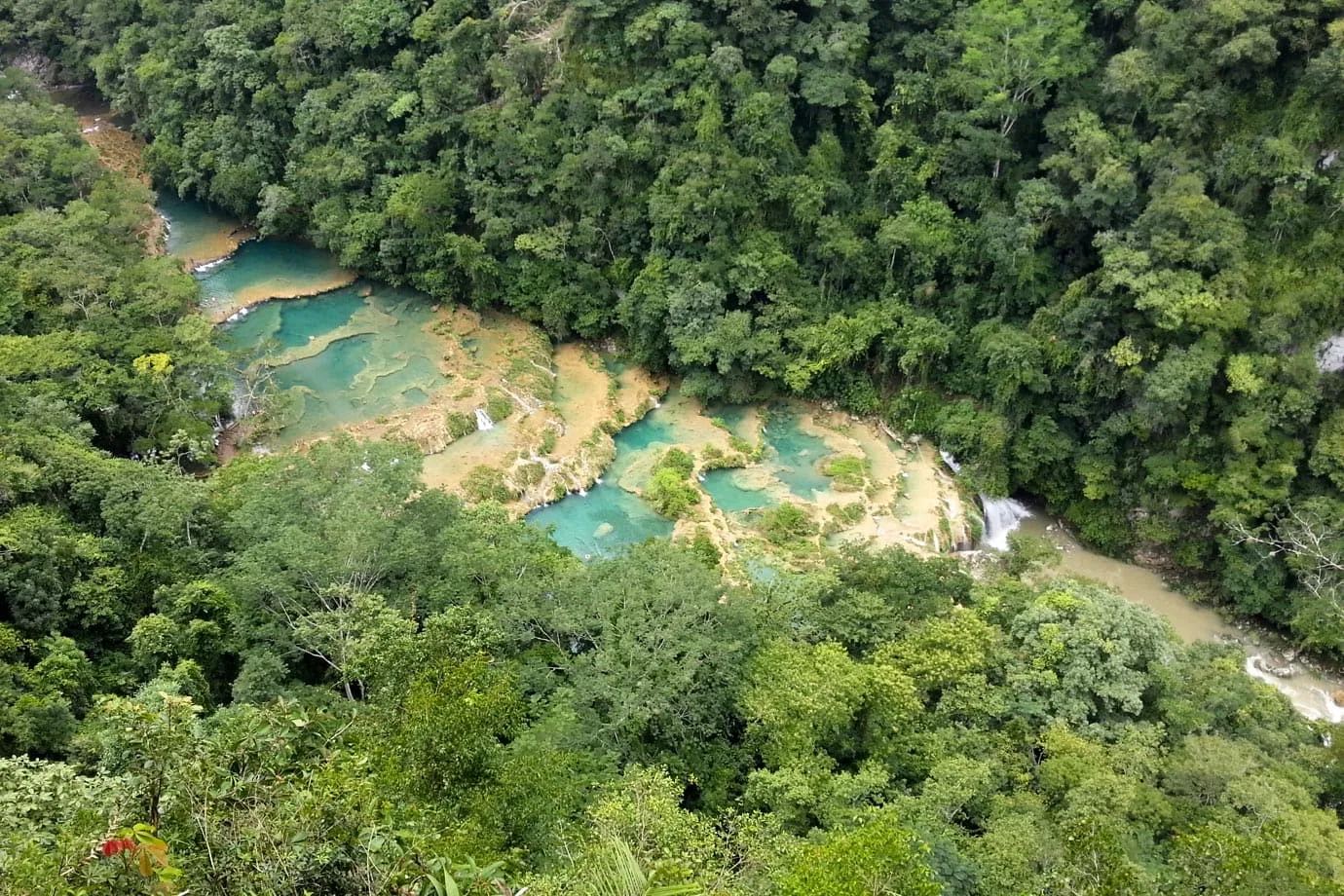 Overlooking the waterfalls at Semuc Champey, it is easy to understand just why so many backpackers make the detour to the area
