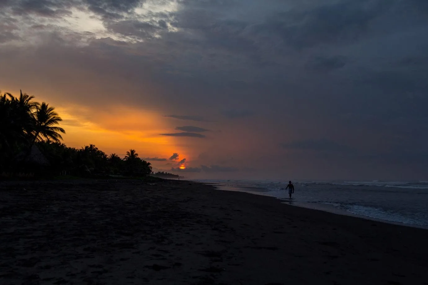 Surfing in El Salvador at sunrise