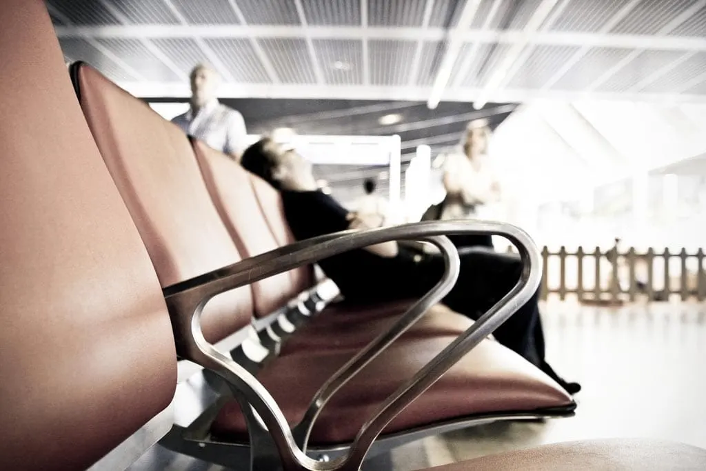 Sleeping on a bench in an airport