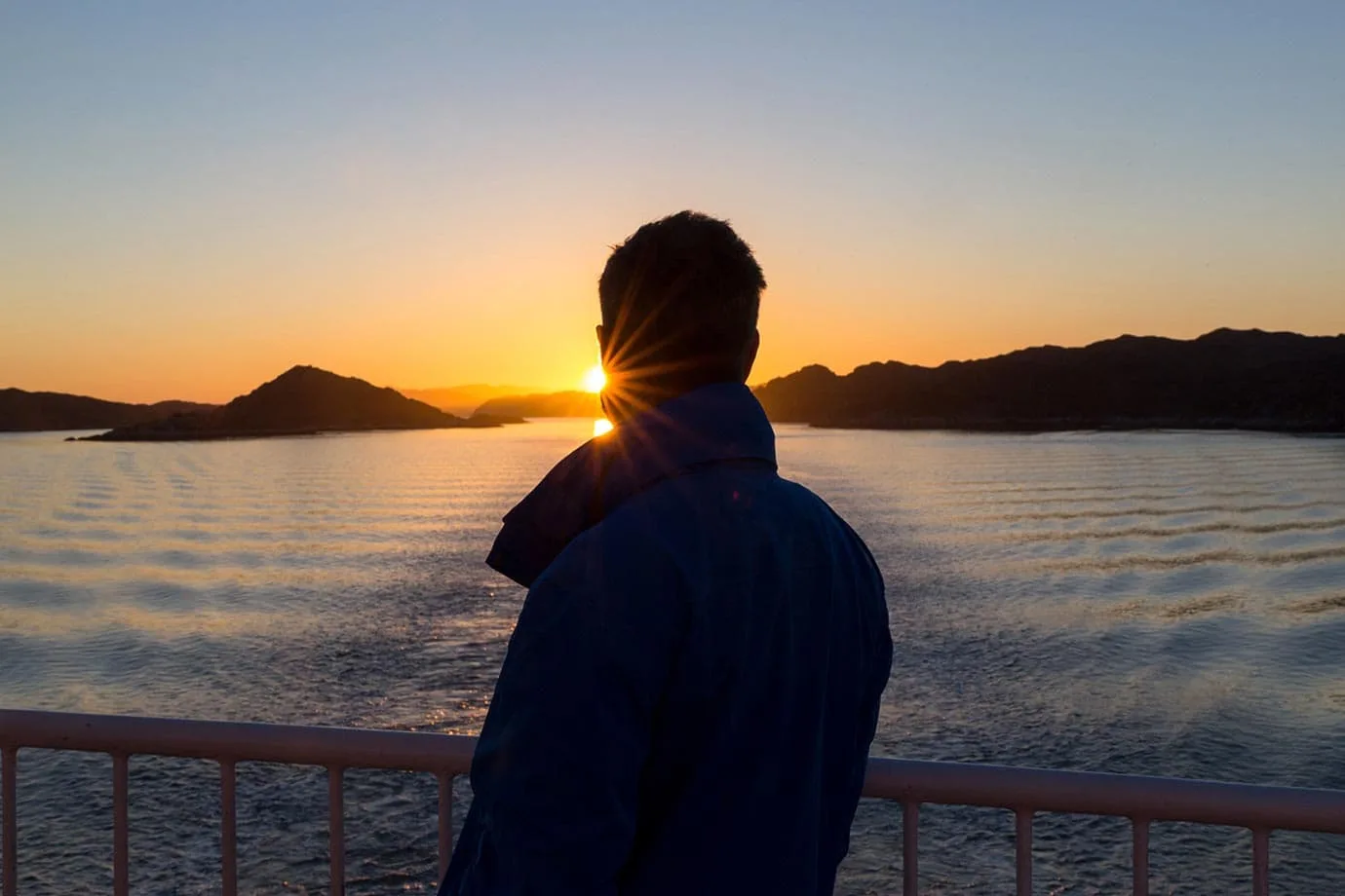 sunset Greenland on a boat