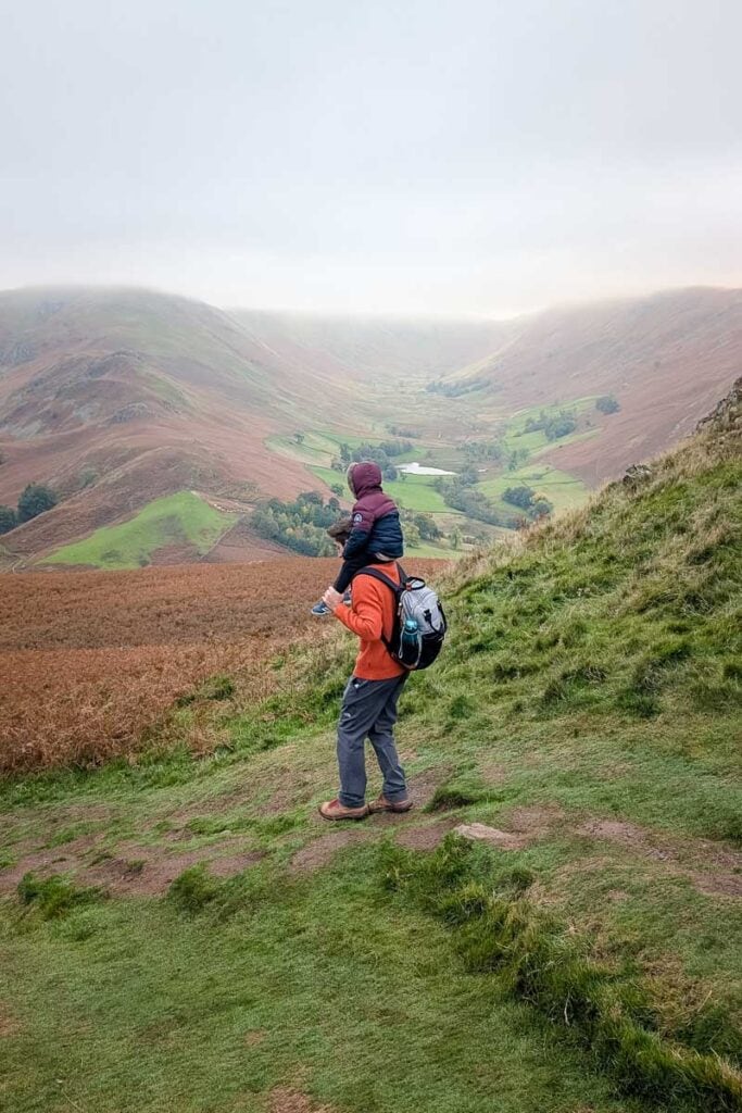 hiking with a kid on shoulders